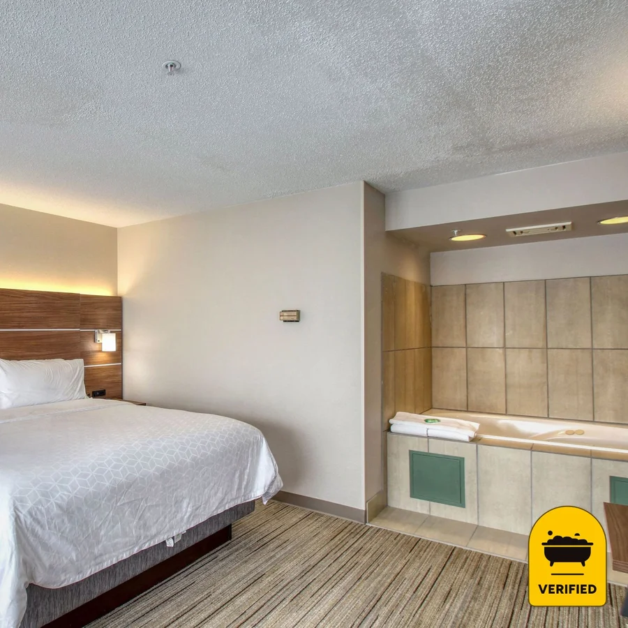 Holiday Inn Express & Suites Oshkosh-Sr 41, an IHG Hotel: the Two Bedroom Suite with Spa tub in Oshkosh, WI